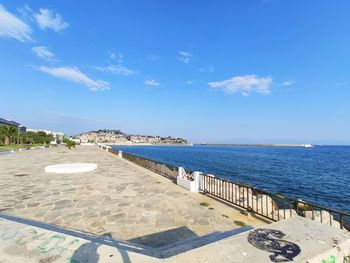 Scenic view of sea against blue sky