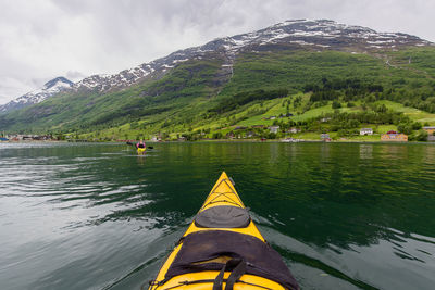 Scenic view of lake and mountains against sky