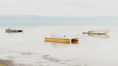 Lifeguard hut on sea against sky