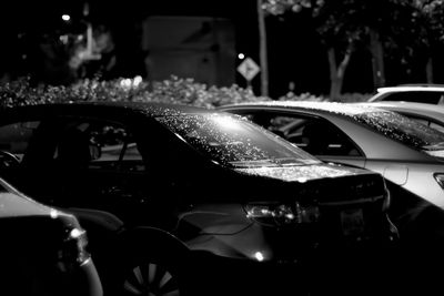 Close-up of car on street at night