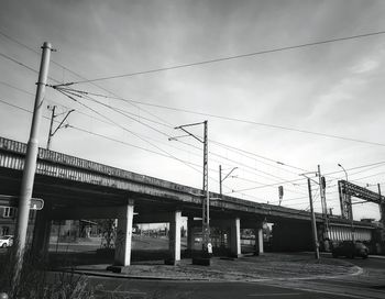 Low angle view of railroad station against sky