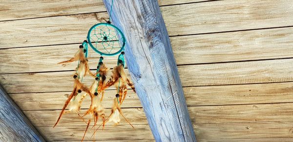 High angle view of horse hanging on wooden table