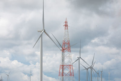 Low angle view of communications tower against sky