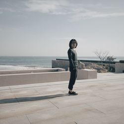 Woman standing on beach