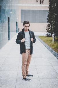 Portrait of young man standing outdoors