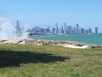 View of city skyline against blue sky