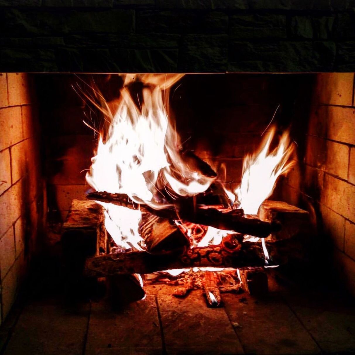 fire - natural phenomenon, fireplace, flame, heat - temperature, wood - material, burning, indoors, no people, close-up, tool, day