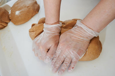 Cropped hand of person preparing food