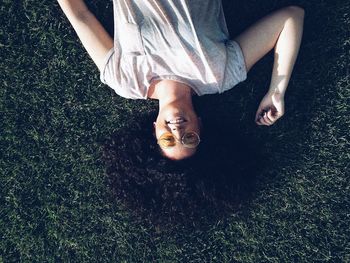 Woman lying on grass