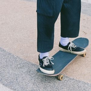 Low section of man standing on street