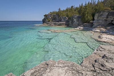 Colorful waters on a secluded indian cove on lake huron in bruce peninsula national pqrk in ontario