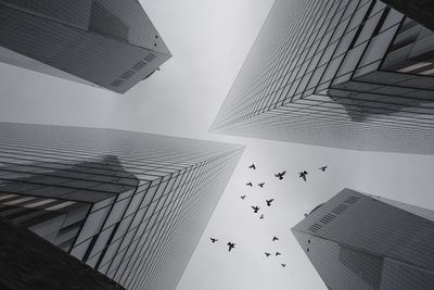 Low angle view of modern buildings against sky