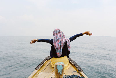 Full length of person in sea against sky