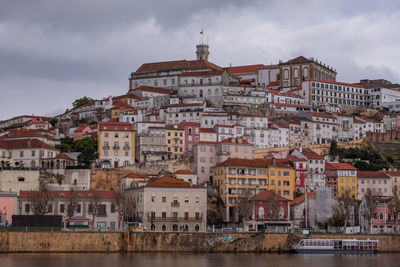 Buildings in town against sky