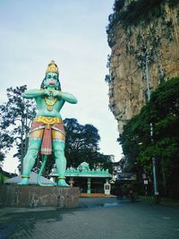 Low angle view of statue against building