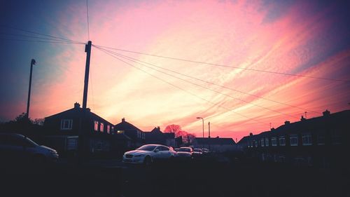 Low angle view of built structure against sky at sunset