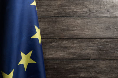 Close-up of flag on wooden table