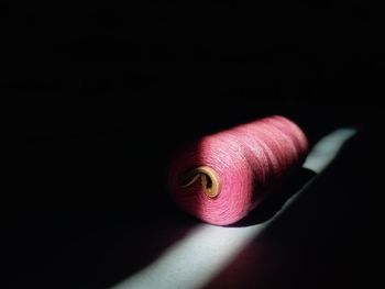 Close-up of pink flower over black background