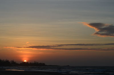 Scenic view of sea against romantic sky at sunset