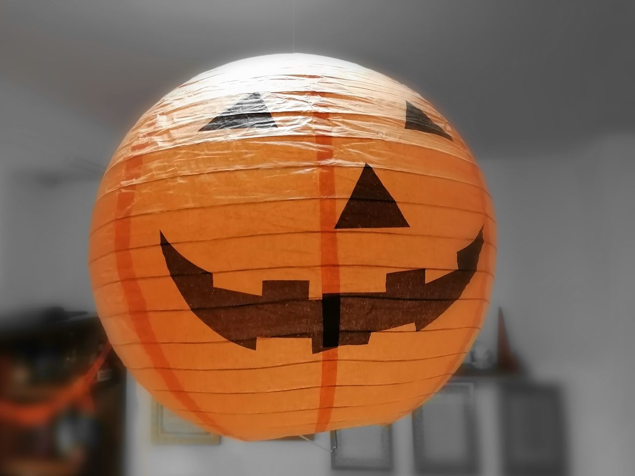 close-up, focus on foreground, anthropomorphic face, anthropomorphic, face, orange color, no people, art and craft, jack o' lantern, pumpkin, celebration, creativity, food, representation, halloween, food and drink, indoors, day, craft