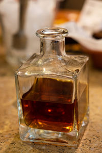 Close-up of glass jars on table