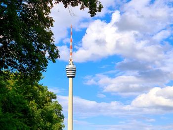 Low angle view of tower against cloudy sky