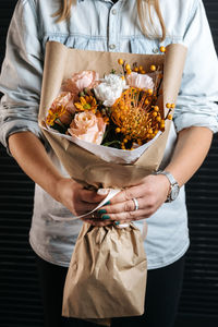 Midsection of woman holding food