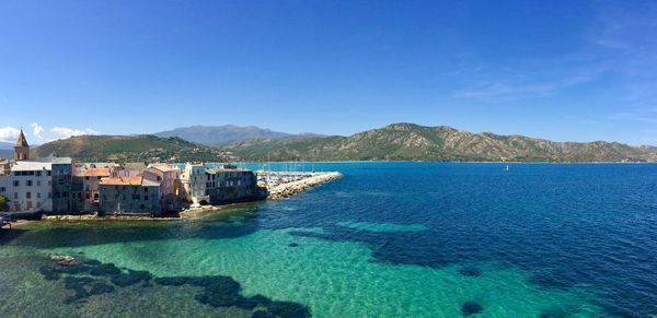 Scenic view of sea against clear blue sky