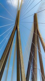 Low angle view of bridge against blue sky