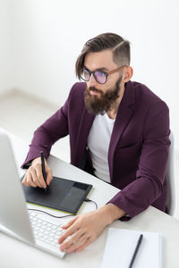 Young man using laptop on table