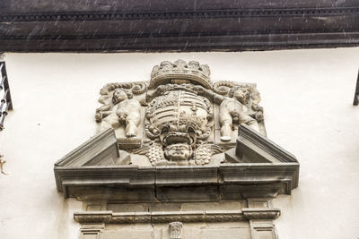 Low angle view of statue against building