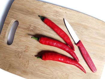 Close-up of red chili peppers on table