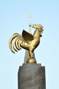 Low angle view of built structure against clear blue sky