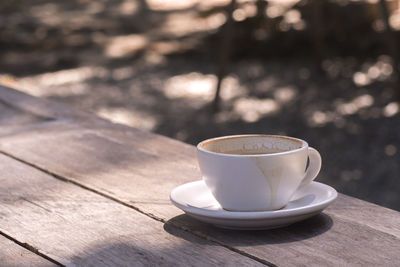 Close-up of coffee cup on table