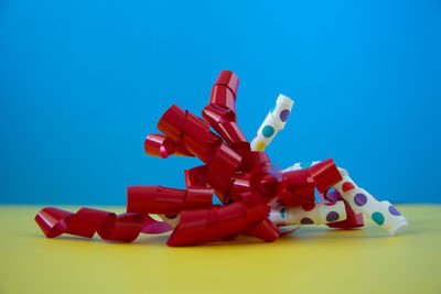 Close-up of toys against blue background