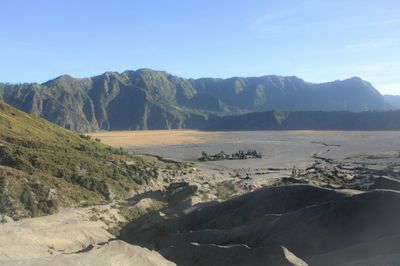 Scenic view of landscape and mountains against sky