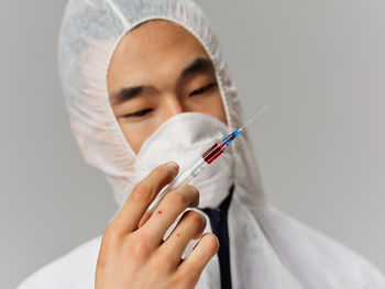 Dentist examining patient at clinic