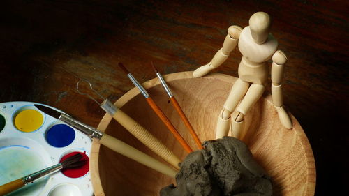 High angle view of figurine on table