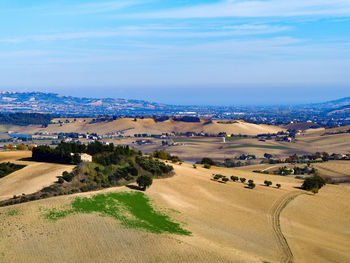 Scenic view of landscape against blue sky