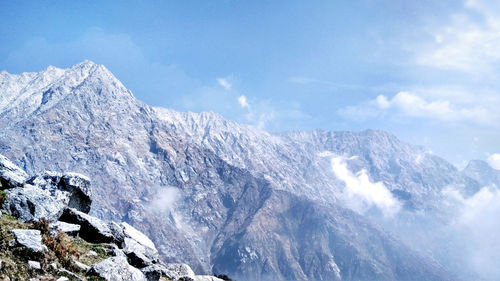 Scenic view of snowcapped mountains against sky