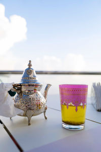 Moroccan tea with a tea cup against the clouds