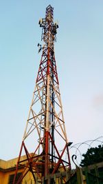 Low angle view of communications tower against sky