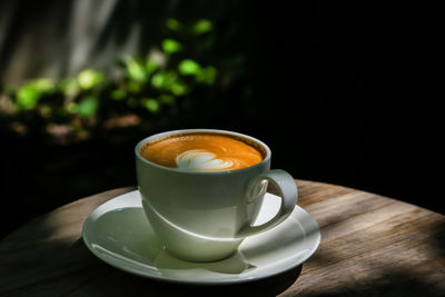 Close-up of coffee cup on table