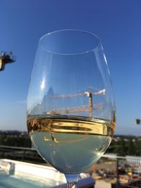 Close-up of wineglass against clear sky