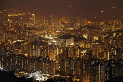 High angle view of illuminated city buildings at night