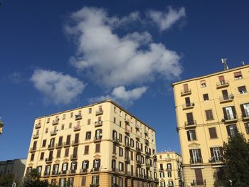 Low angle view of building against blue sky