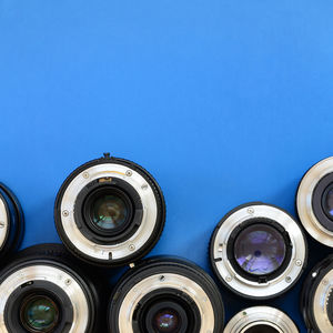 High angle view of lens on blue background