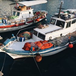 High angle view of fishing boats moored at harbor