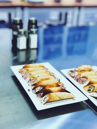 Close-up of dessert served in plates on table