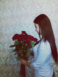 Young woman holding flower bouquet